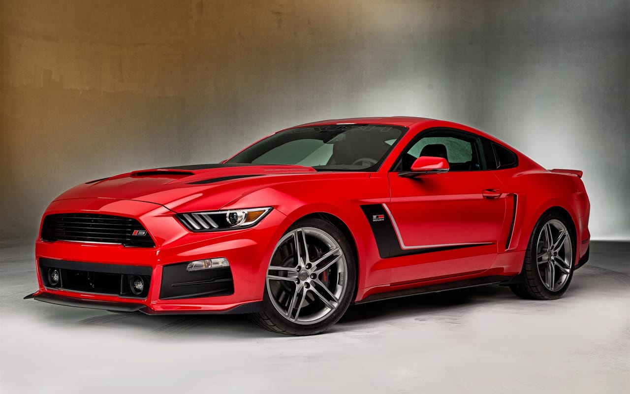 Detailed red Ford Mustang with a glossy, polished finish by OG Detailing in Huntley, IL